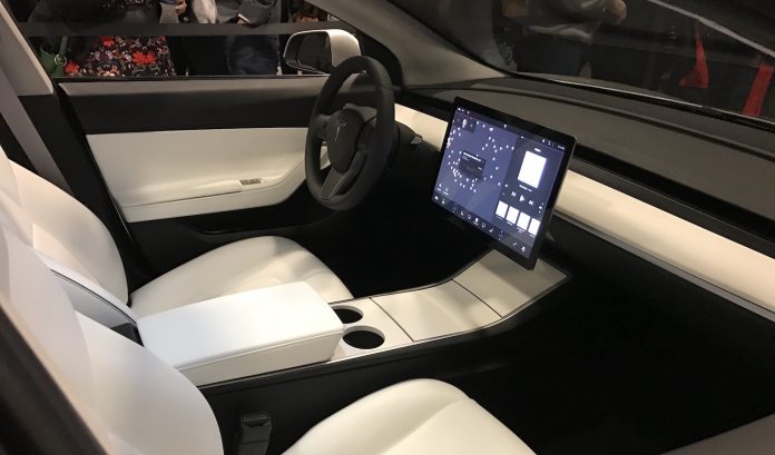 Silver-Tesla-Model-3-interior-cupholder-touchscreen Tesla